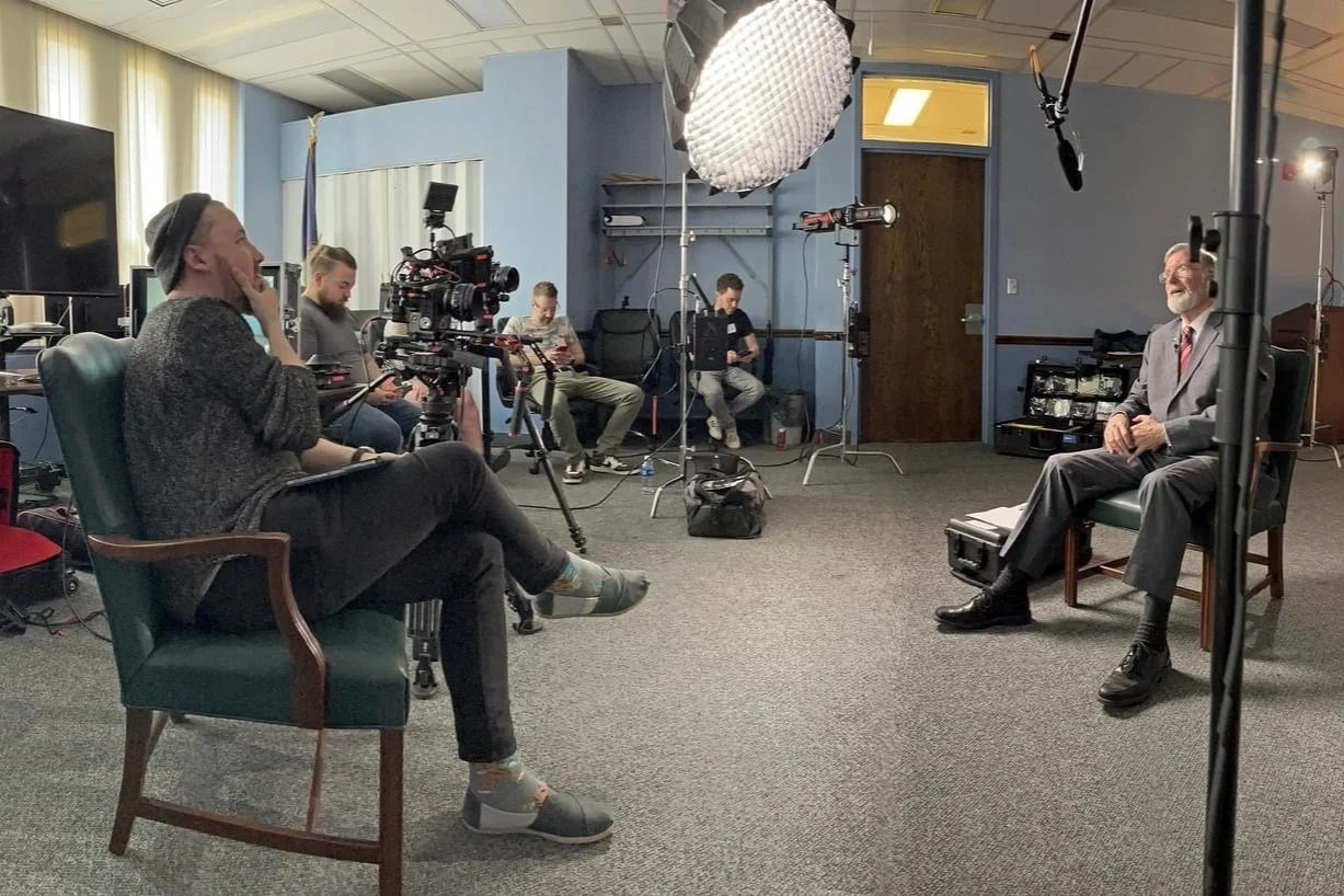 Documentary interview set with cameras, lights and crew