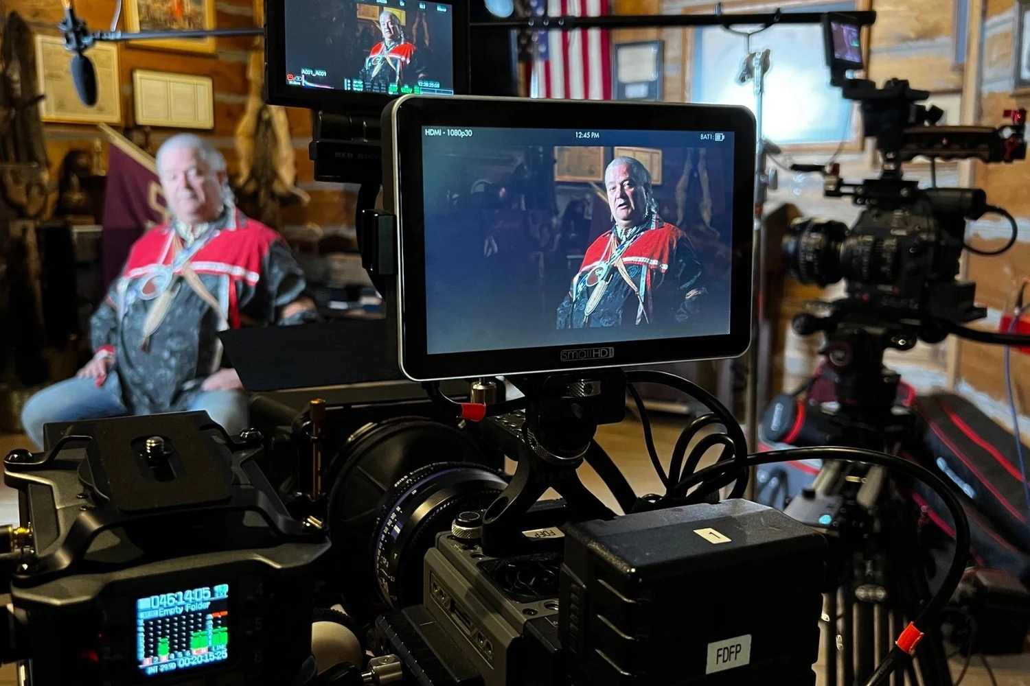 Camera monitor framing an interview during a documentary shoot